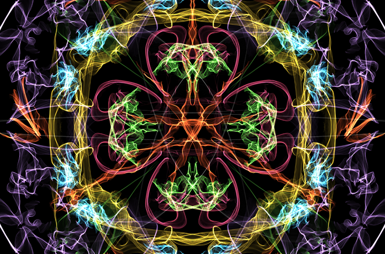An abstract image made up of mirrored sets of colored lines swirling on a black background.